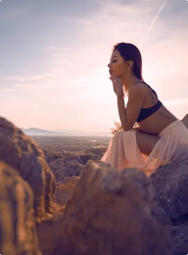 beautiful girl poses in sunset